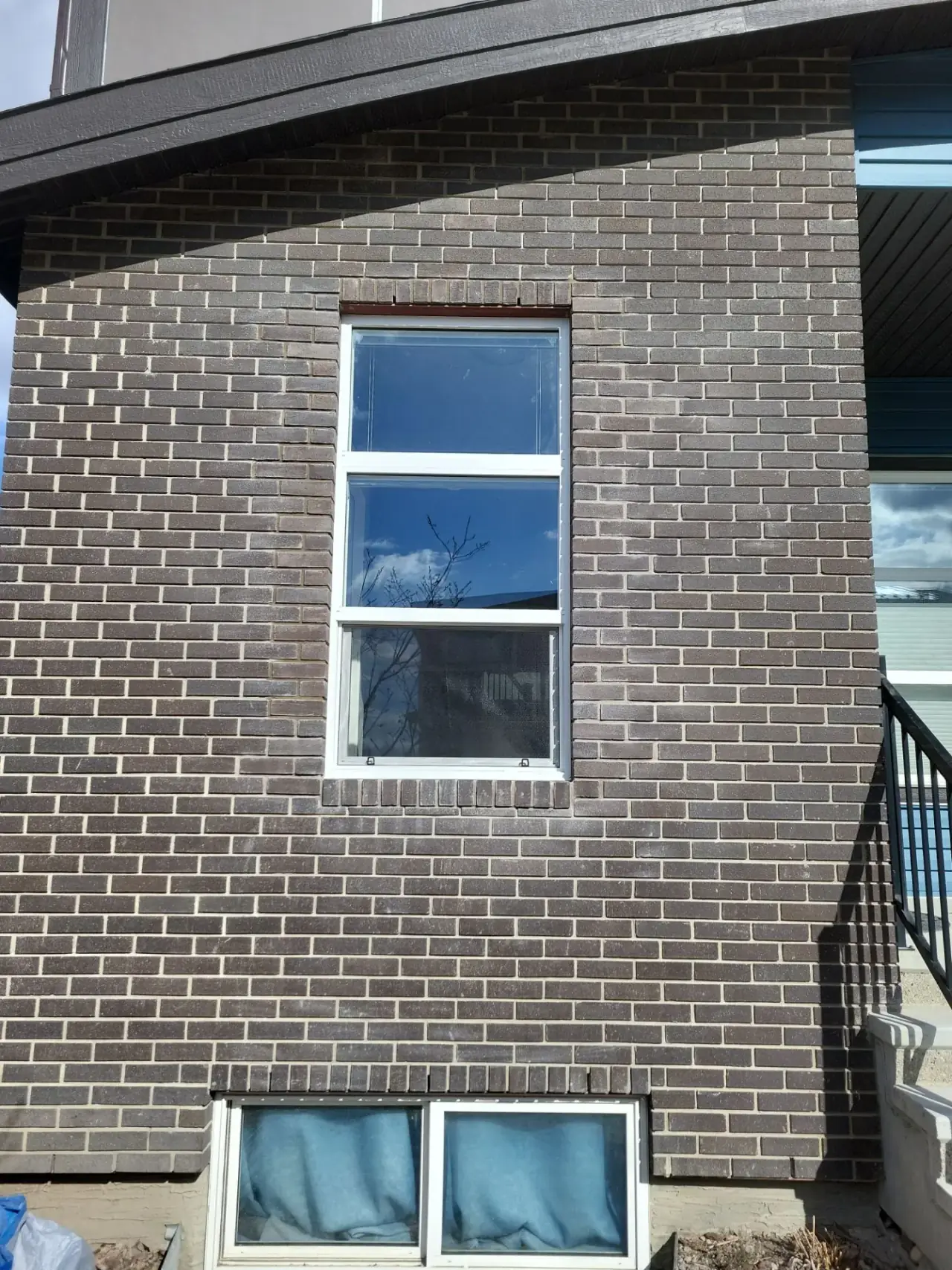 Restored brickwork around commercial window after replacement
