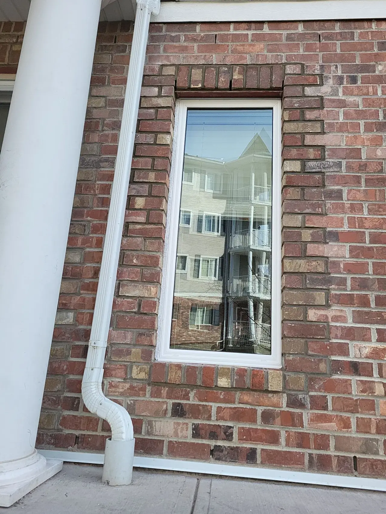 Restored residential brickwork around window after replacement