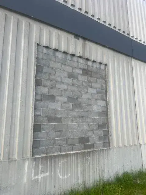 Commercial building after cinderblock infill and finish