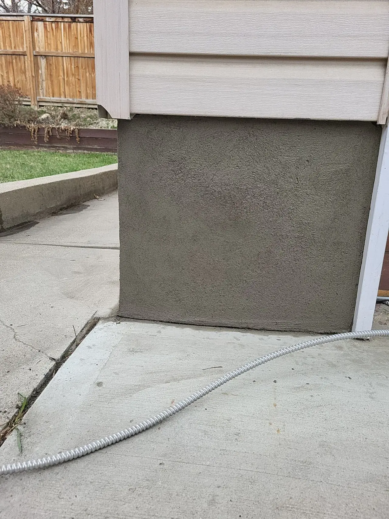 Garage foundation with new floated parging finish