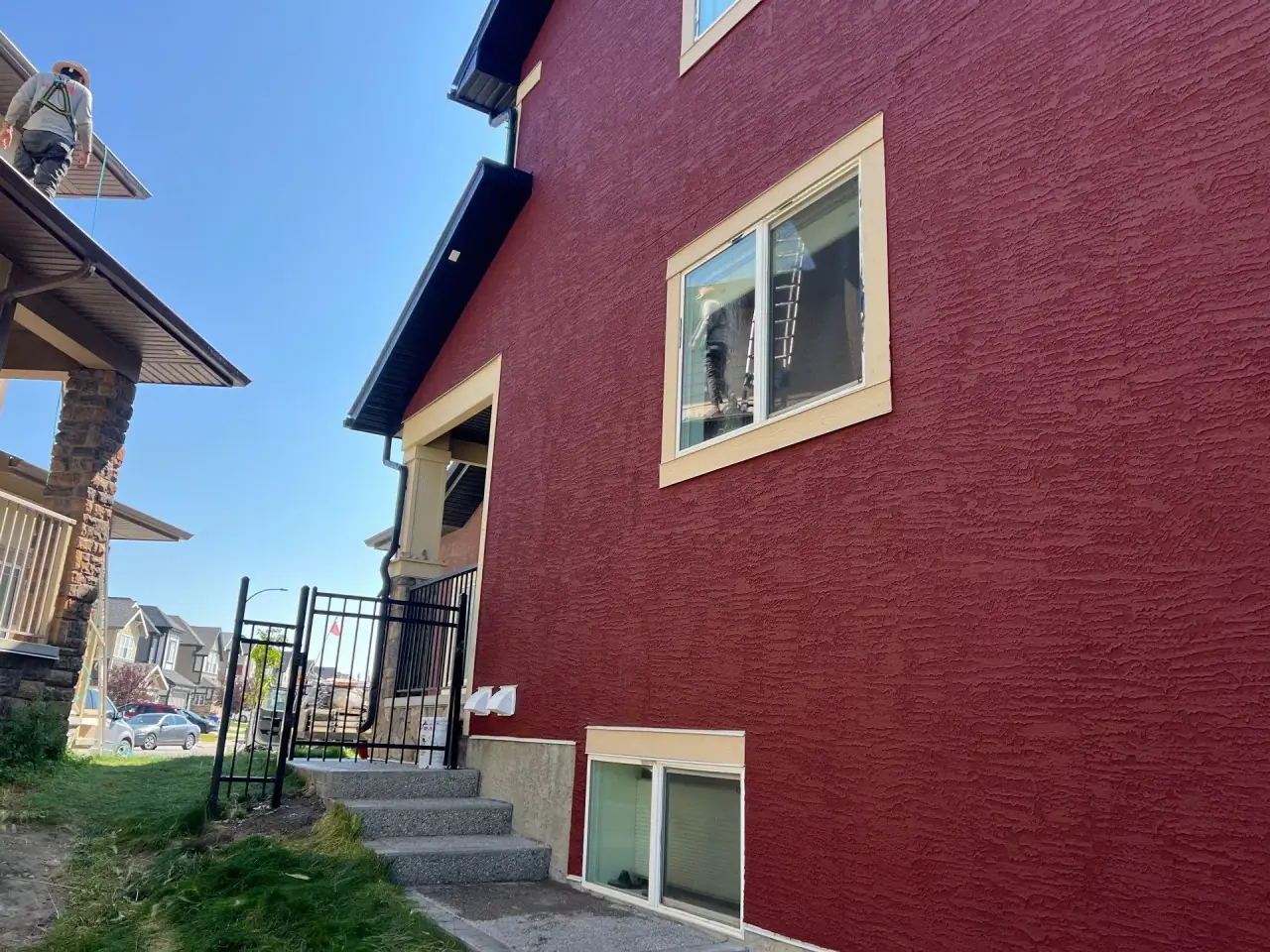 Same elevation finished in new textured red stucco