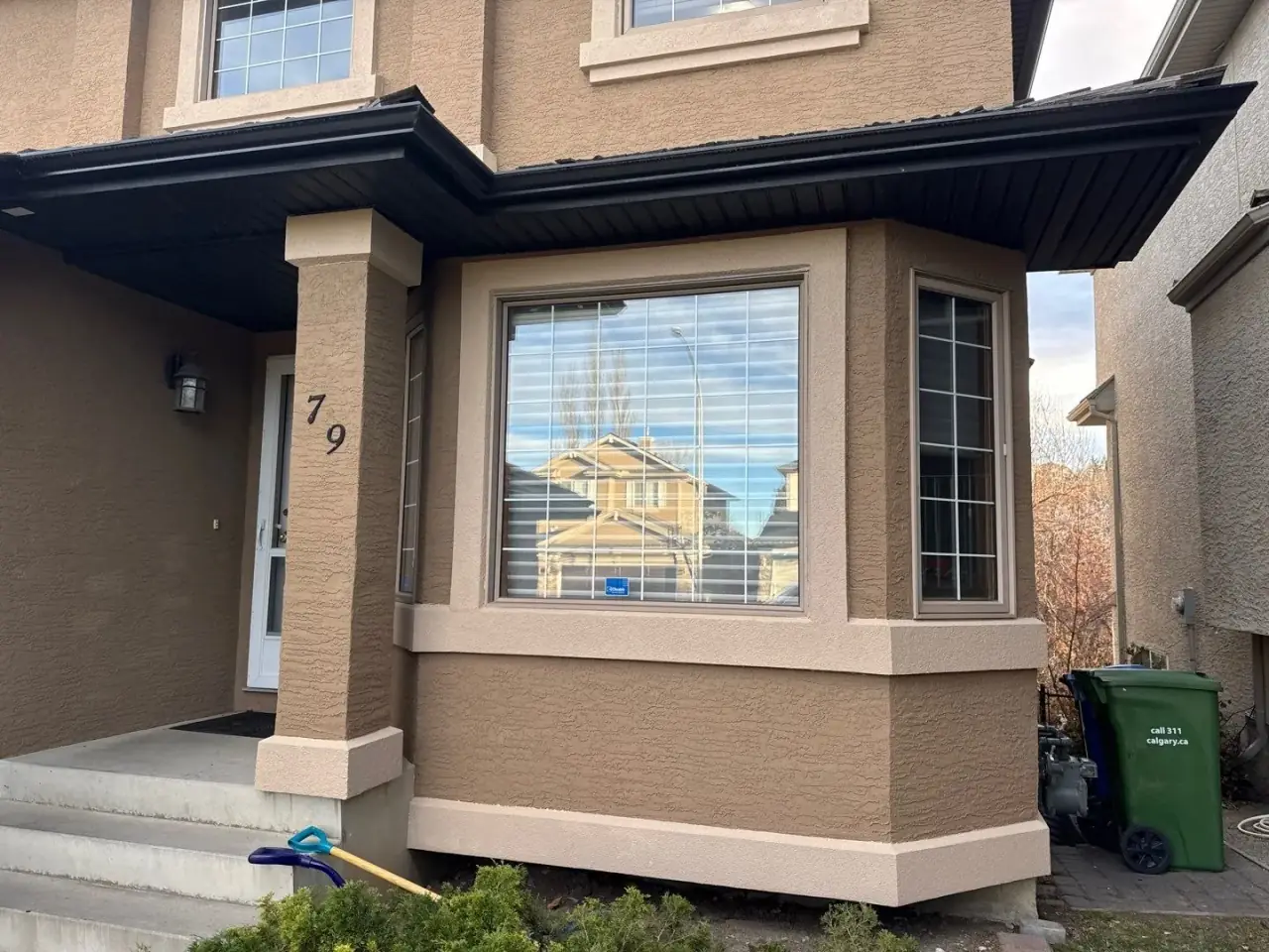 Stucco wall after elastomeric painting by Calgary Parging