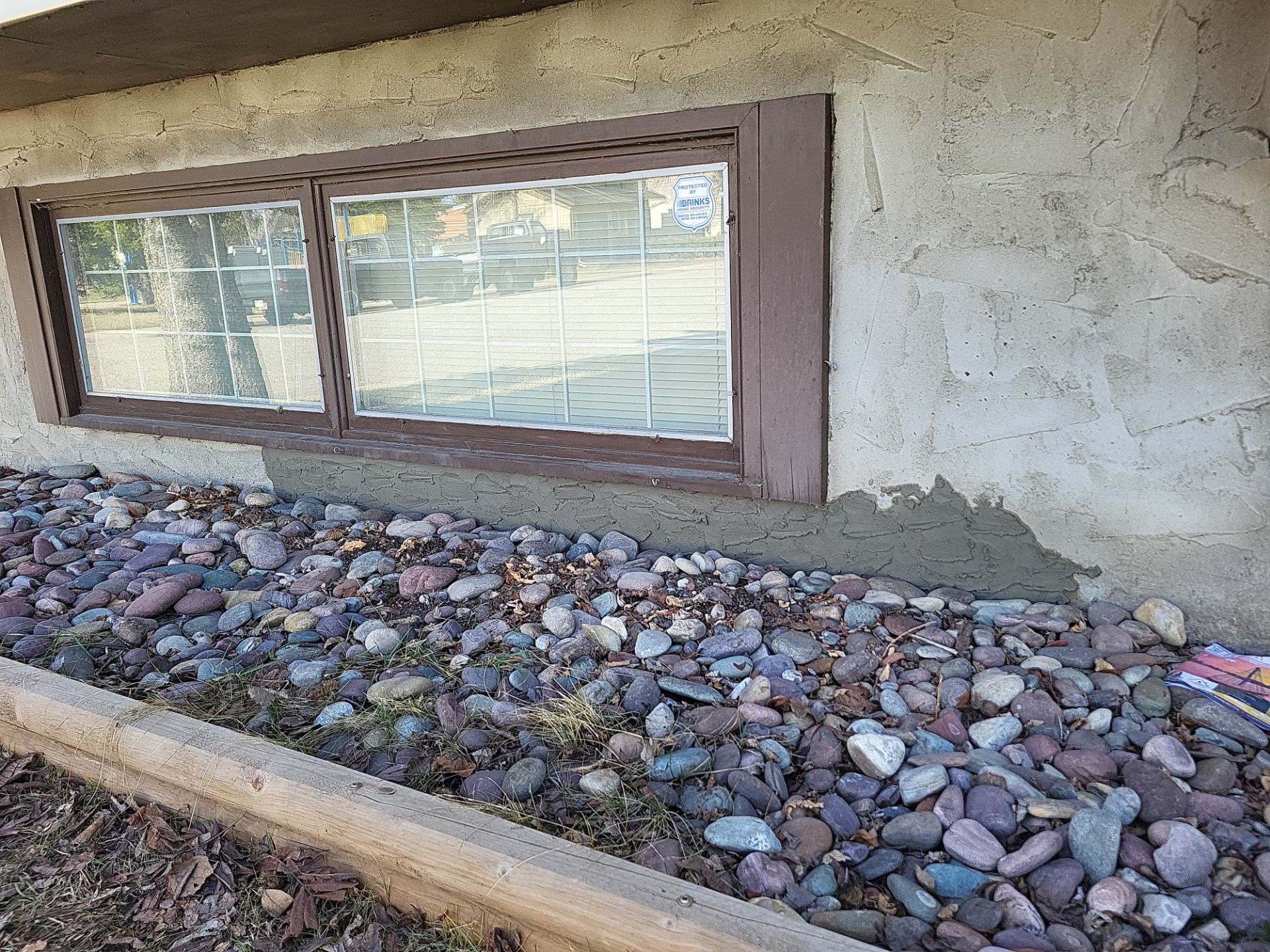 Parging under the window restored after repair