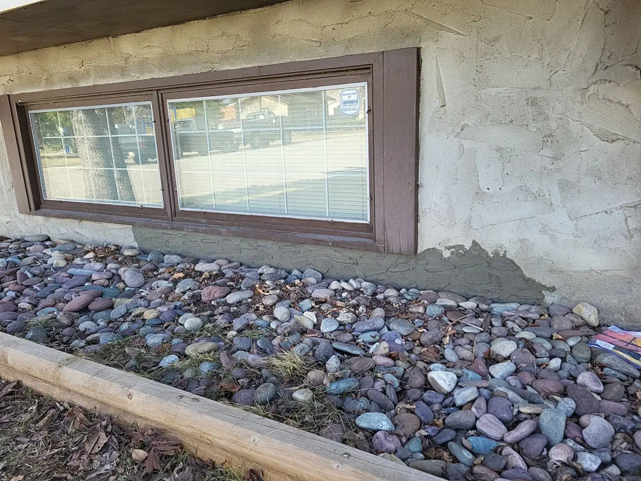 Parging under the window restored after repair