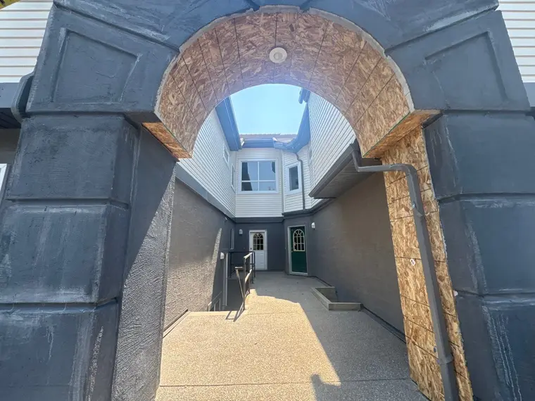 Arched portico stripped back and the rough framing rebuilt