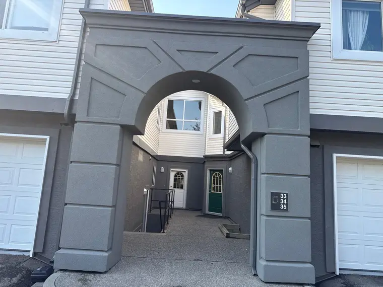 Finished arched portico in a new floated acrylic stucco finish