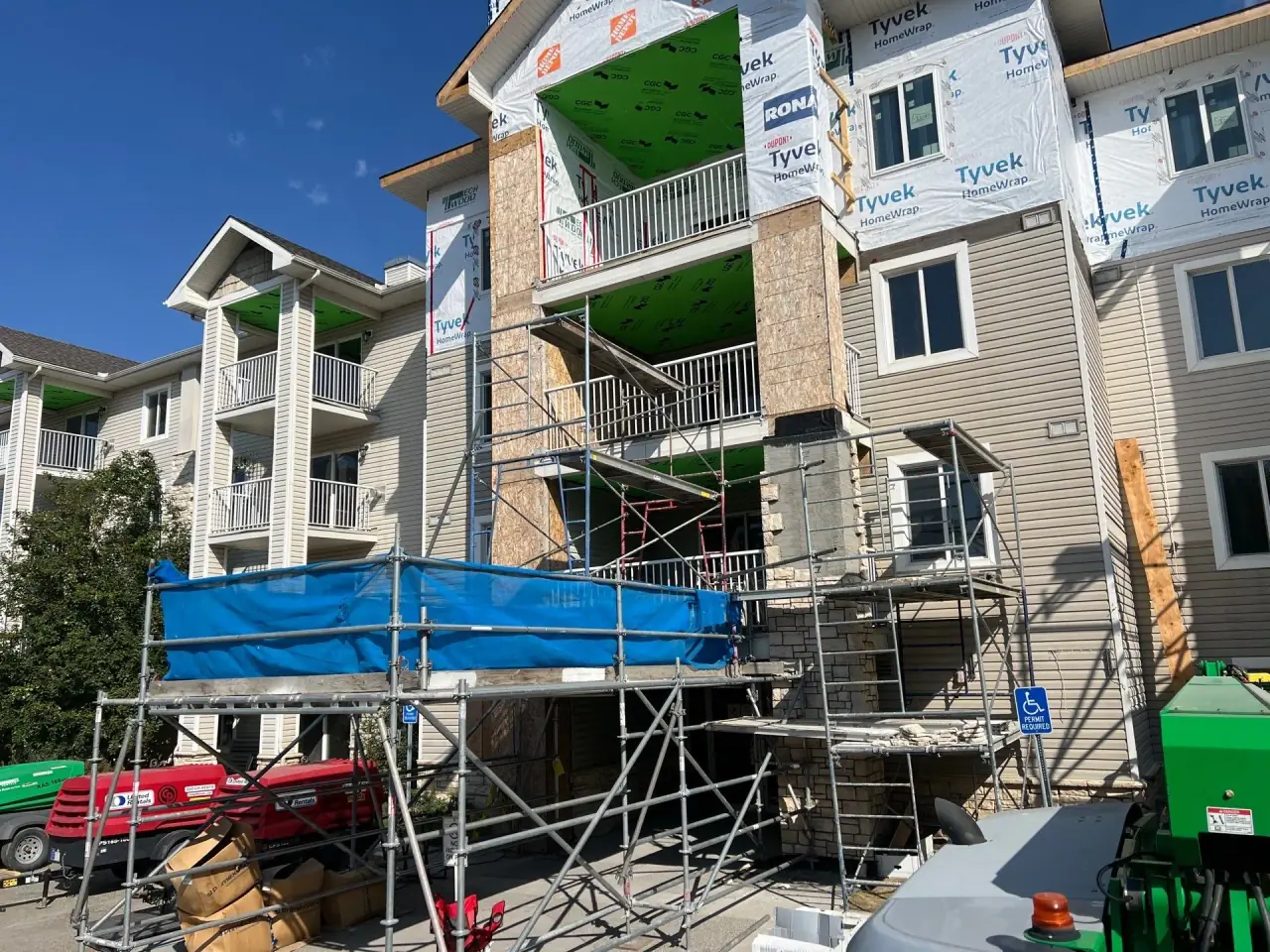 Bare three-story column before natural stone installation