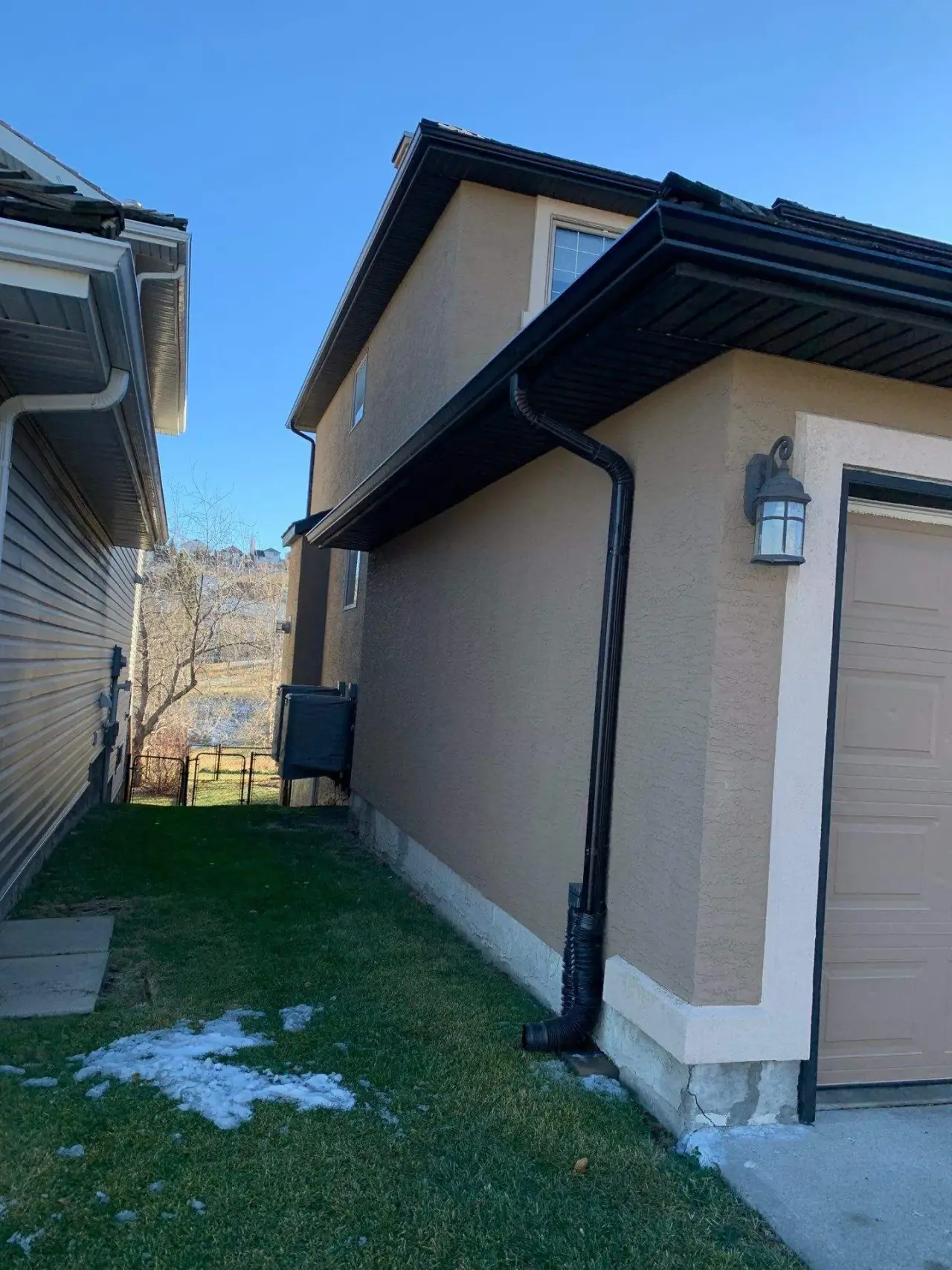 Calgary home with weathered stucco before painting