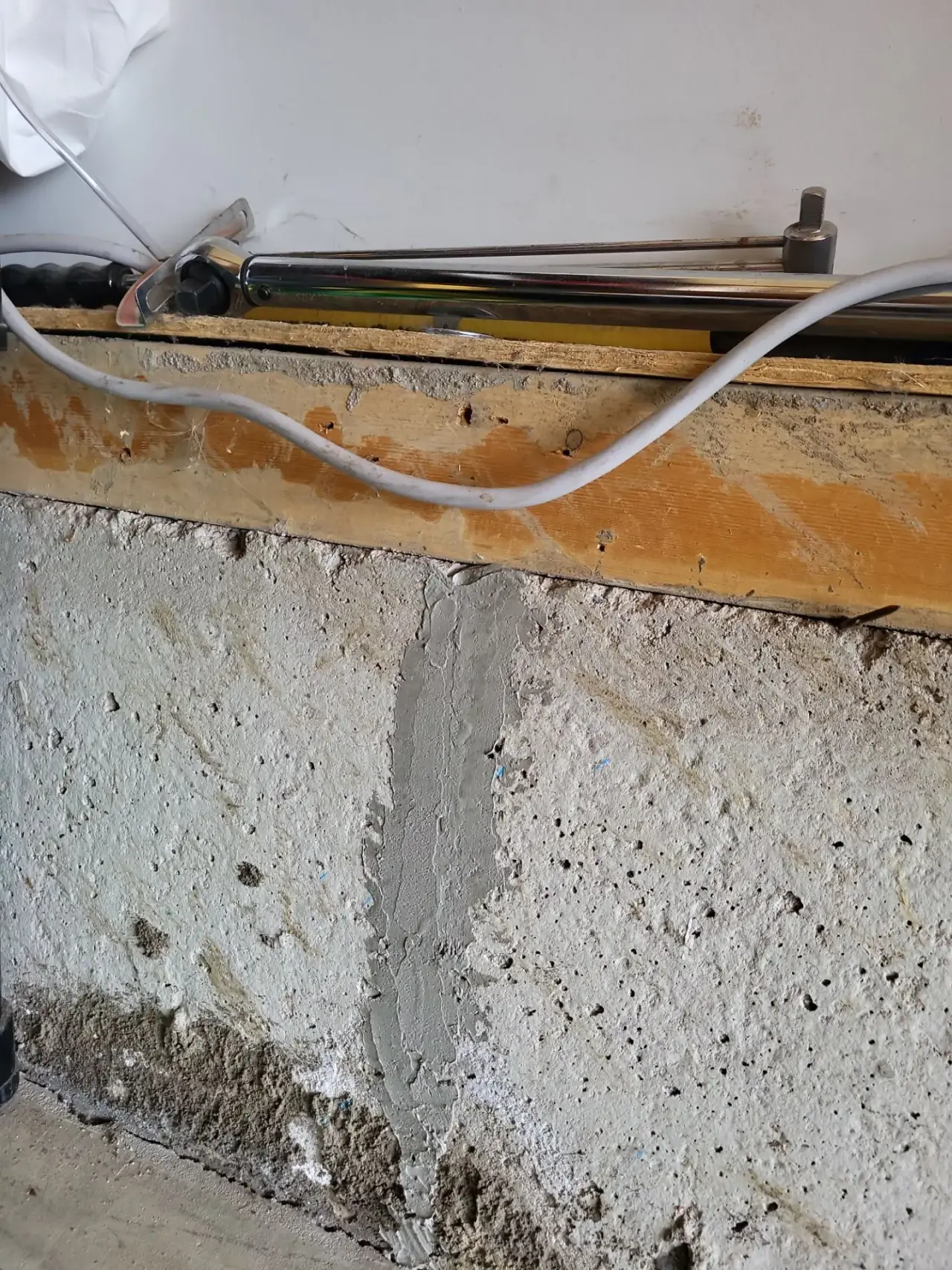 Garage foundation crack patched and sealed after repair