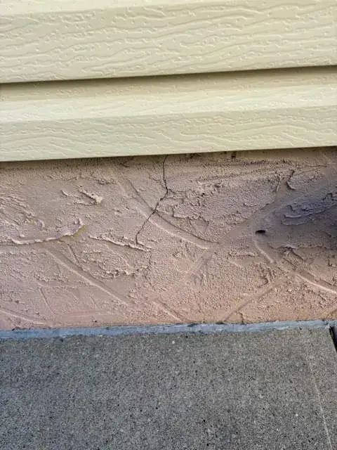 Old deteriorated parging at foundation level