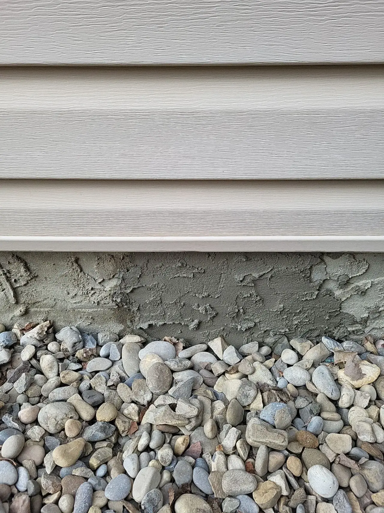 Same wall after crack repair and re-parging