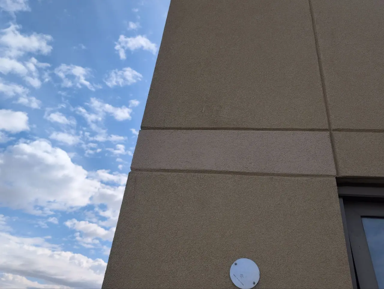 Condo unit balcony stucco repaired and protected against woodpeckers