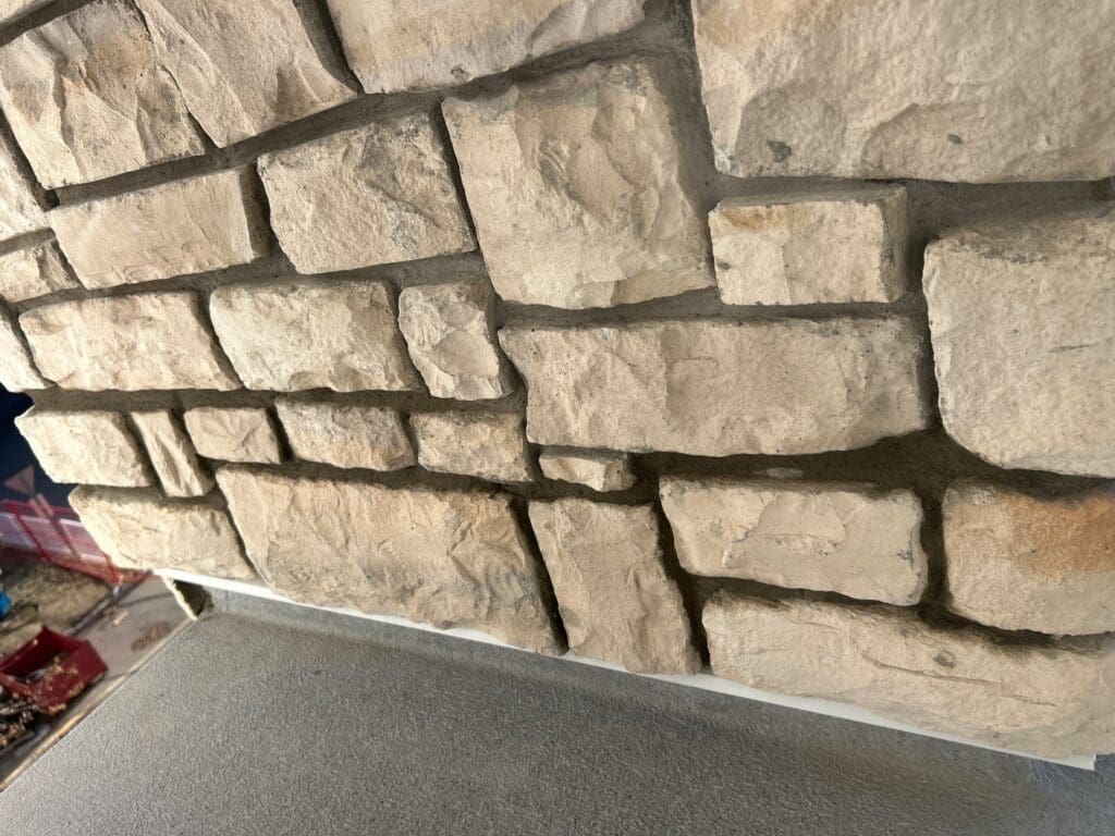 natural stone, with flashing to balcony