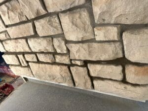 natural stone, with flashing to balcony